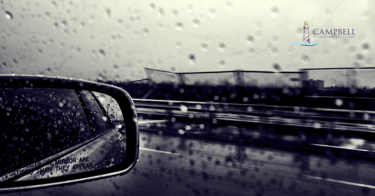 an image of a car mirror in the rain